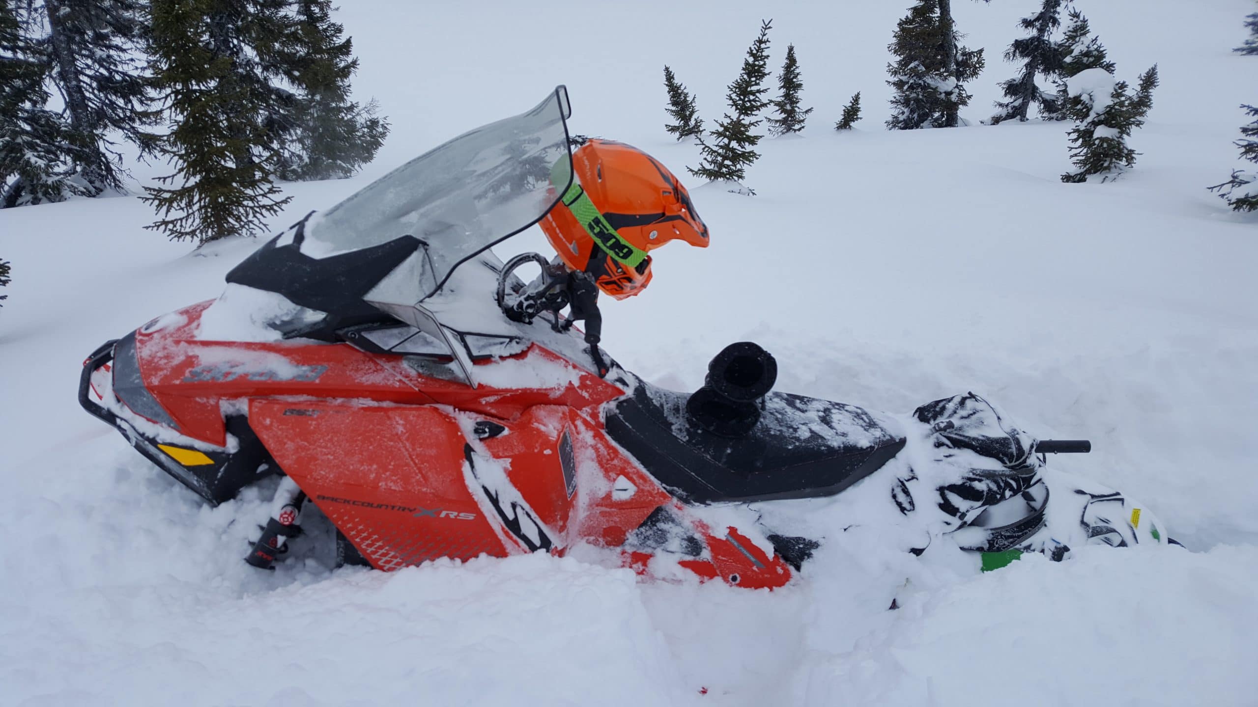 women snowmobiling