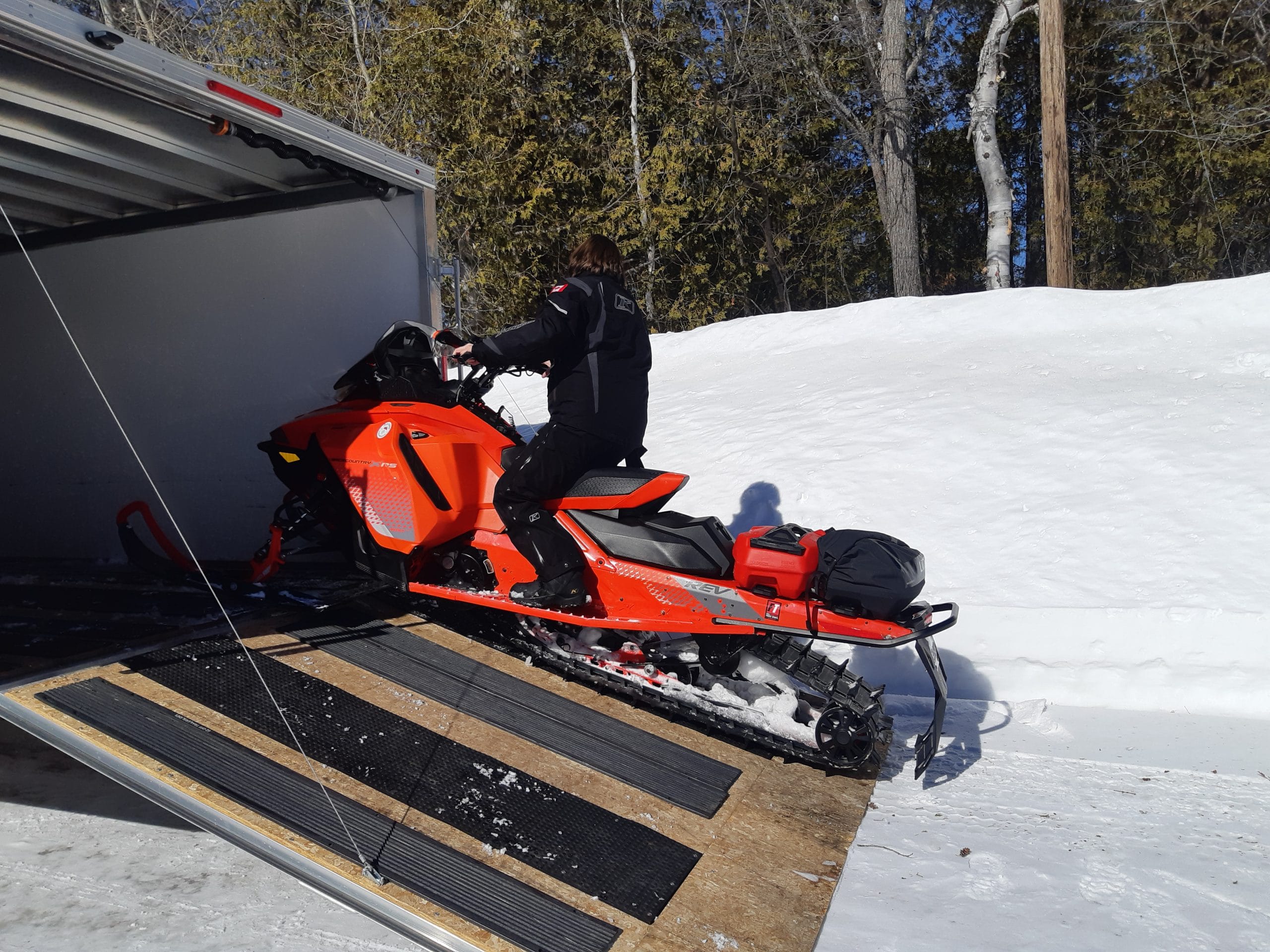 women snowmobiling