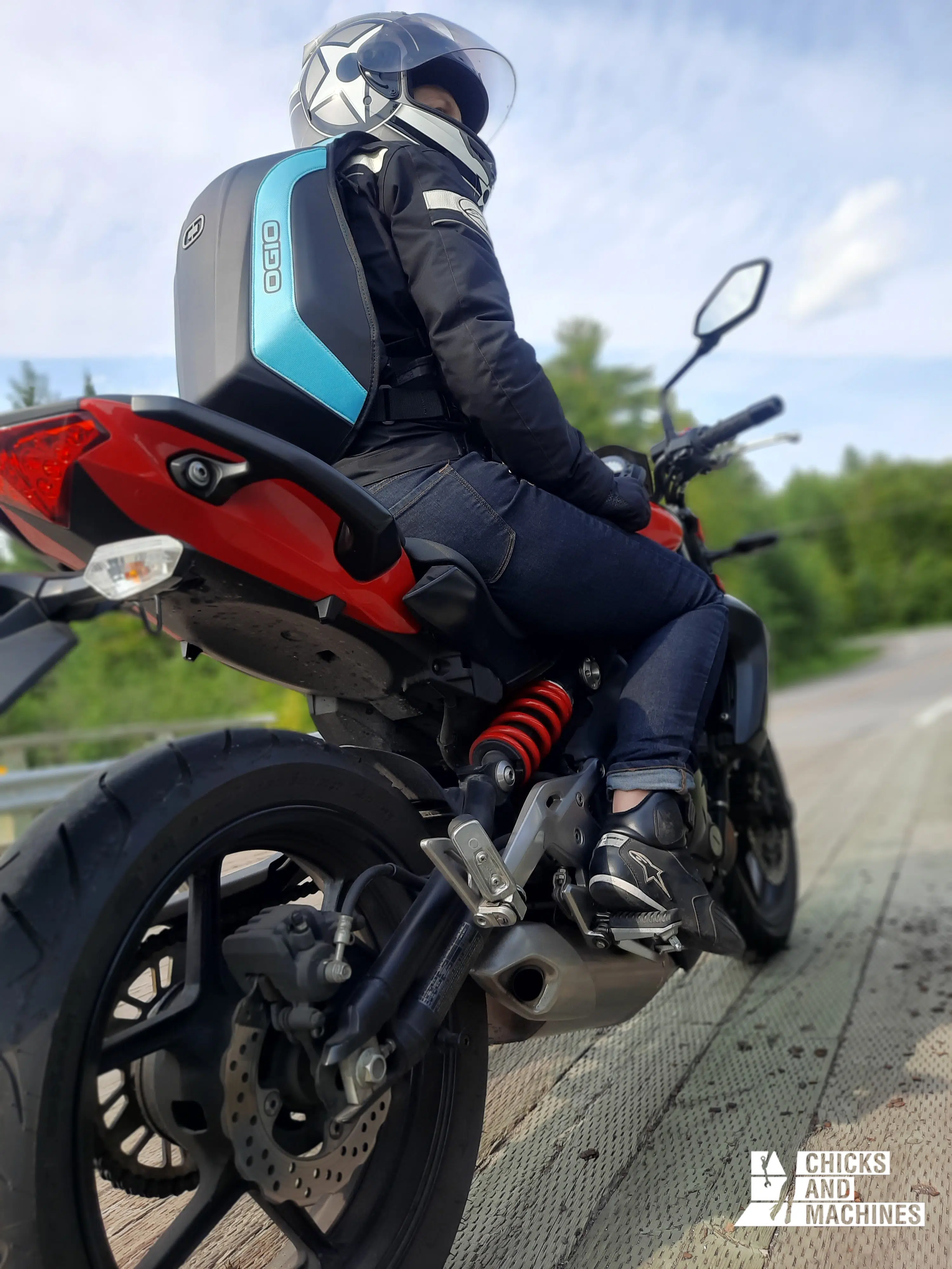 Cyndie on her motorcycle with her beautiful OGIO bag.