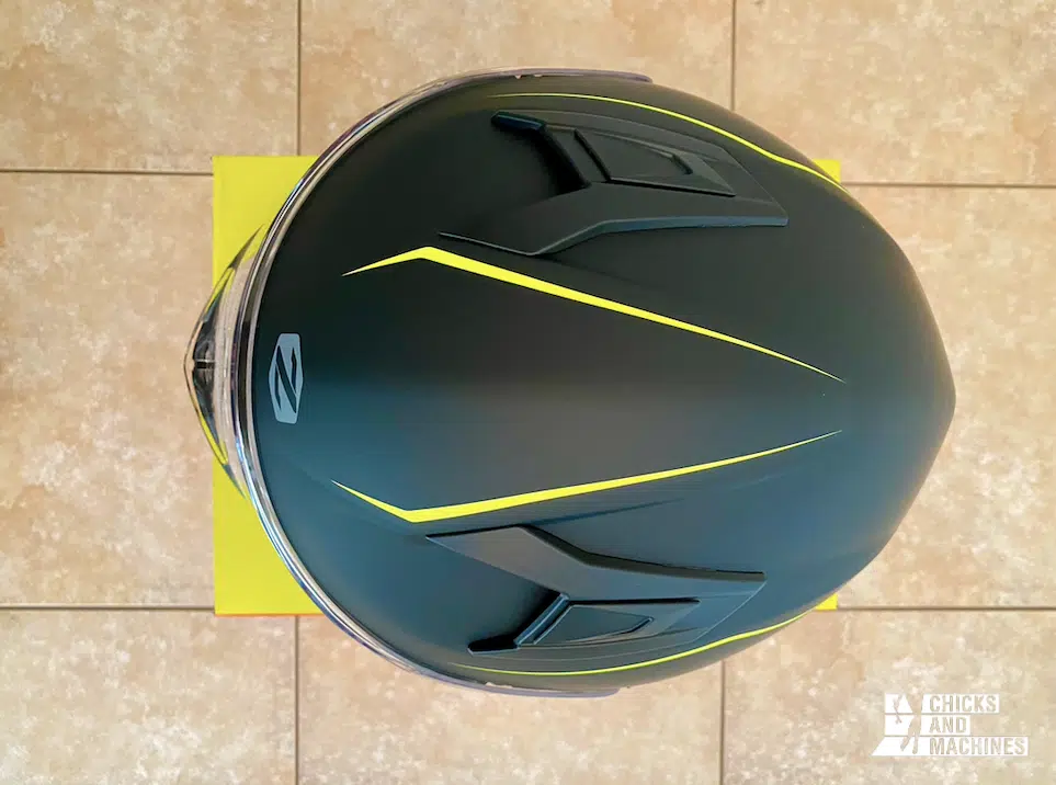 The Zox Zenith helmet shows a sleek fluorescent yellow trim color.