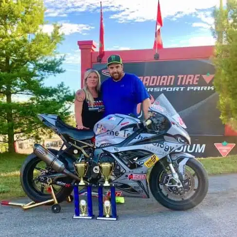 Marc Labossière with his trophies and his spouse Caroline Tourigny.