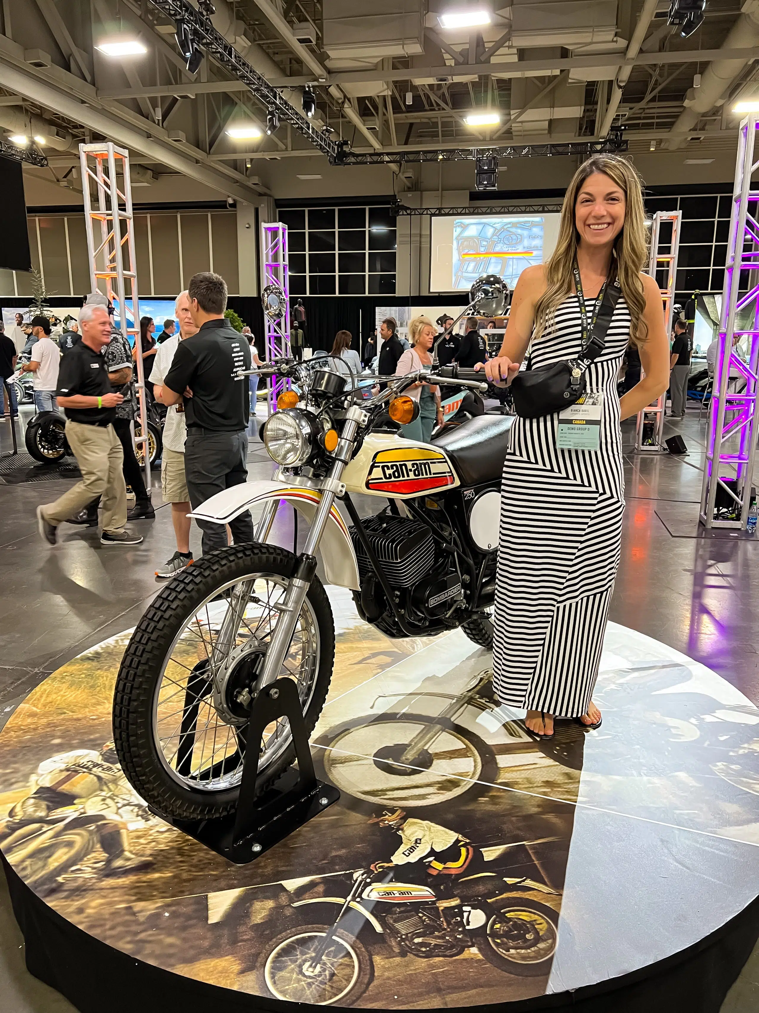Bianca B. and the legendary Can-Am two-wheel motorcycle from the seventies, during the big Can-Am 2022 unveiling last summer. photo credit: @bianca.baril