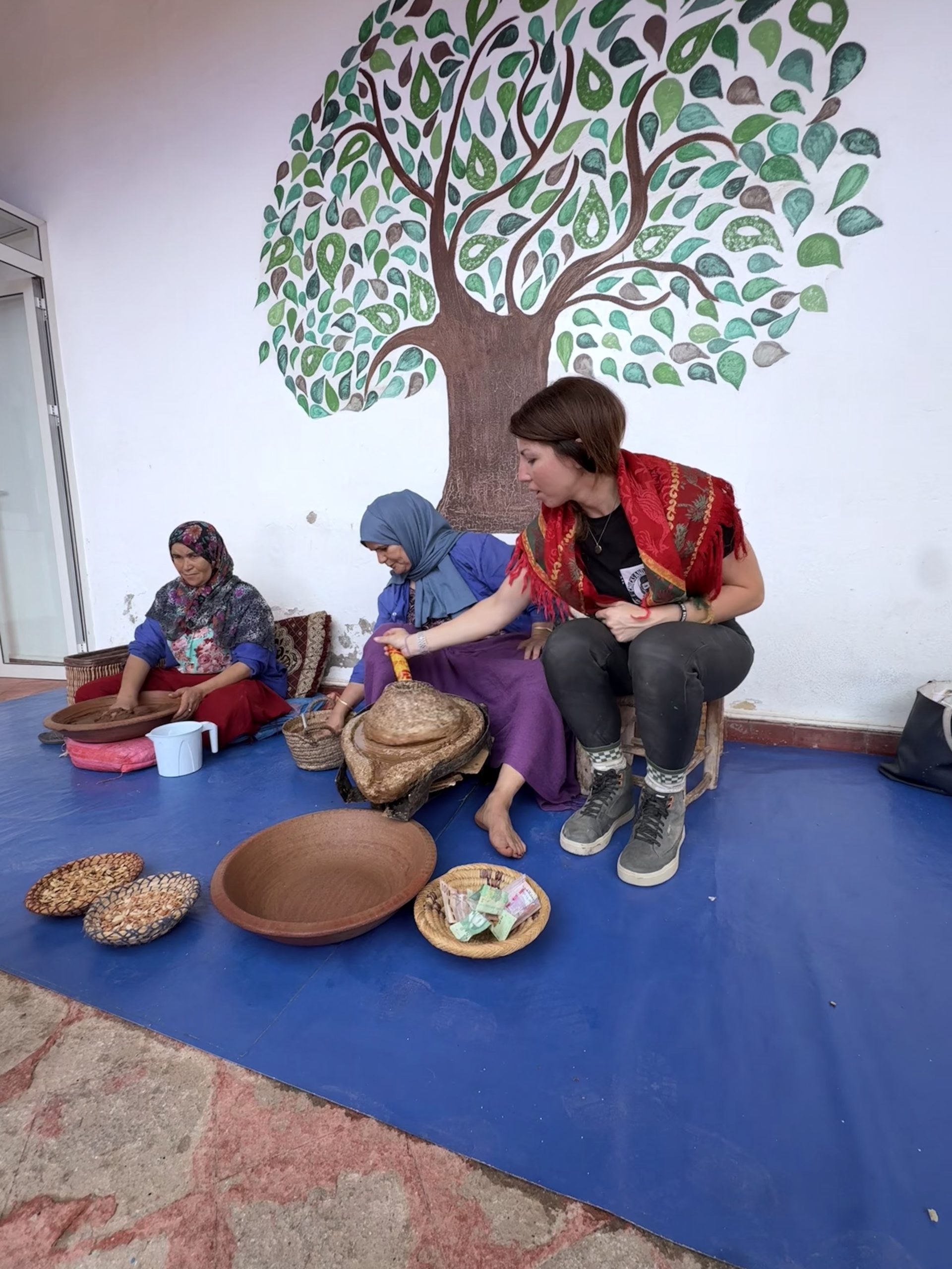 Gabrielle grinds argan to make argan oil, a typical product of Morocco. Gabrielle grinds argan to make argan oil, a typical product of Morocco.